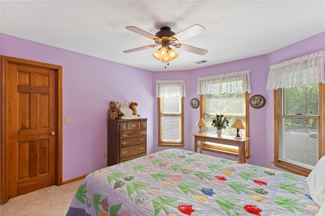 11808 W 128th St, Overland Park, KS 66213 - carpeted bedroom with a ceiling fan