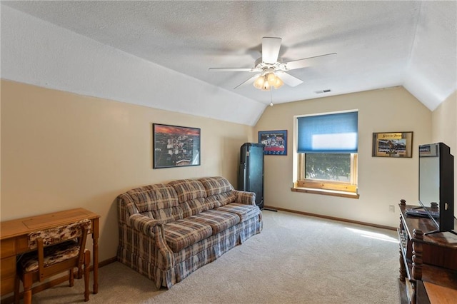 11808 W 128th St, Overland Park, KS 66213 - carpeted living room featuring vaulted ceiling, a ceiling fan, and a textured ceiling