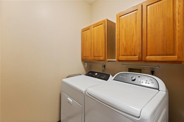 11808 W 128th St, Overland Park, KS 66213 - laundry room featuring cabinet space and washing machine and clothes dryer