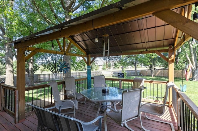 11808 W 128th St, Overland Park, KS 66213 - wooden terrace featuring outdoor dining space, a fenced backyard, and a gazebo