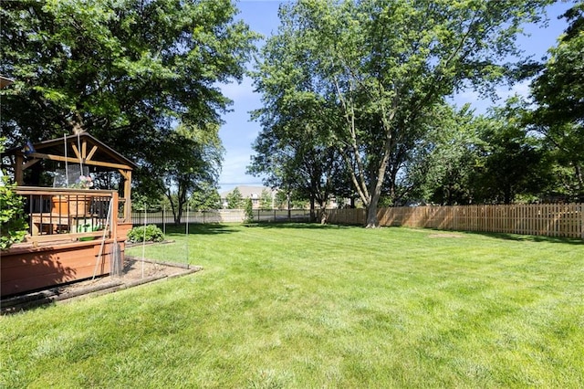 11808 W 128th St, Overland Park, KS 66213 - fenced backyard featuring a wooden deck and a gazebo