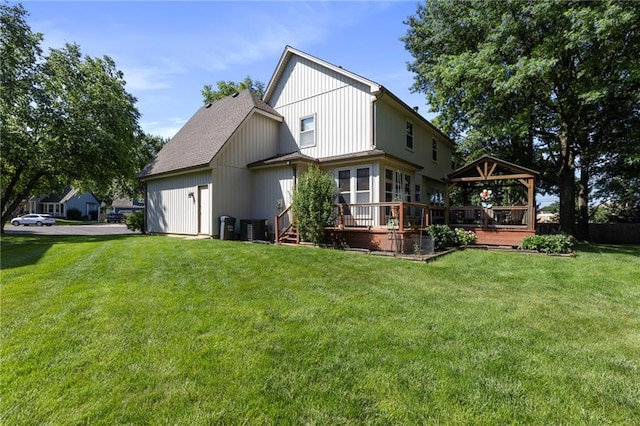 11808 W 128th St, Overland Park, KS 66213 - rear view of property with a gazebo, a wooden deck, a lawn, and a shingled roof