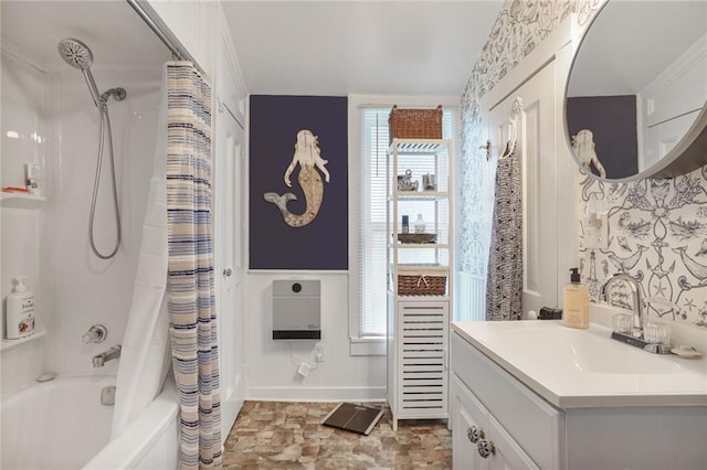 311 E Mary St, Yates Center, KS 66783 - full bathroom featuring shower / tub combo with curtain, vanity, heating unit, wainscoting, and a decorative wall