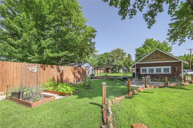 311 E Mary St, Yates Center, KS 66783 - view of yard featuring a garden and a detached carport