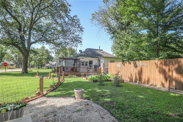 311 E Mary St, Yates Center, KS 66783 - view of yard with a wooden deck