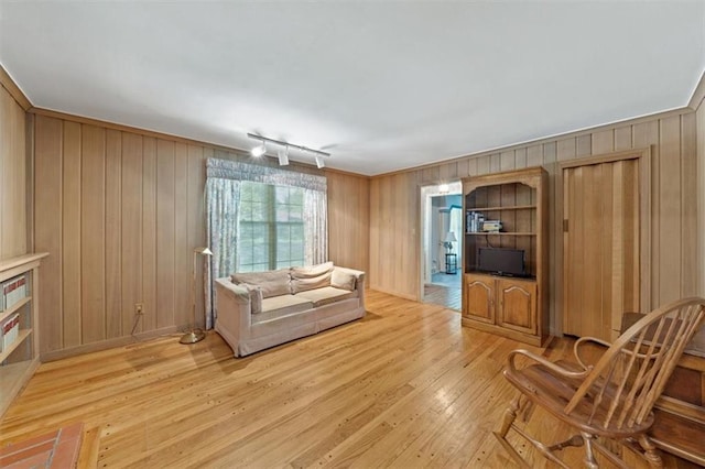 5211 W 79th Ter, Prairie Village, KS 66208 - living room with light wood-type flooring and wooden walls