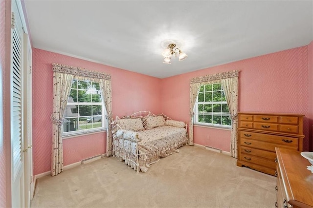 5211 W 79th Ter, Prairie Village, KS 66208 - carpeted bedroom with baseboards and a chandelier