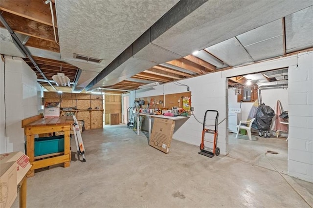 5211 W 79th Ter, Prairie Village, KS 66208 - unfinished below grade area with washer / clothes dryer and a workshop area