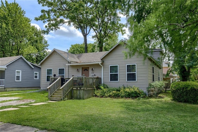 203 E Elm St, Olathe, KS 66061 - view of front of home with a front lawn and roof with shingles