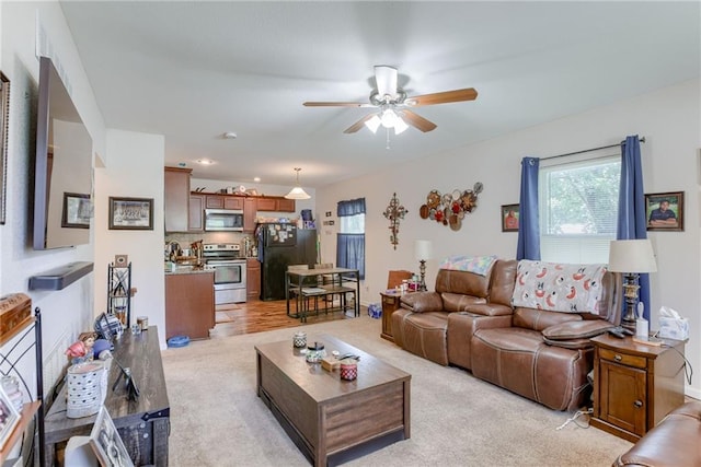 203 E Elm St, Olathe, KS 66061 - living area with ceiling fan and light carpet