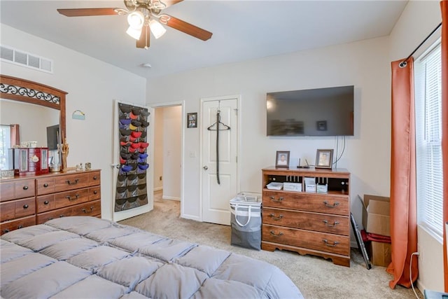 203 E Elm St, Olathe, KS 66061 - carpeted bedroom with multiple windows and a ceiling fan
