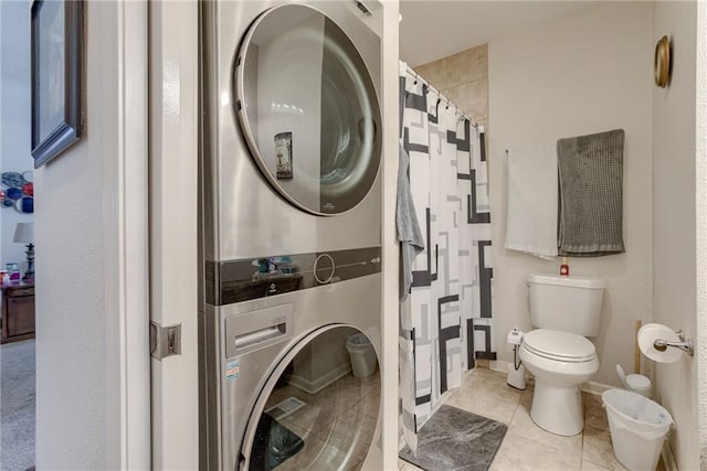 203 E Elm St, Olathe, KS 66061 - full bathroom featuring stacked washer and clothes dryer, tile patterned floors, and a shower with shower curtain