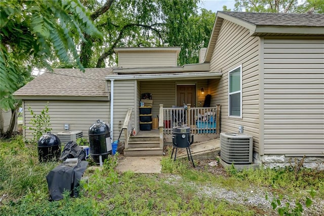 203 E Elm St, Olathe, KS 66061 - back of house with a shingled roof and a wooden deck