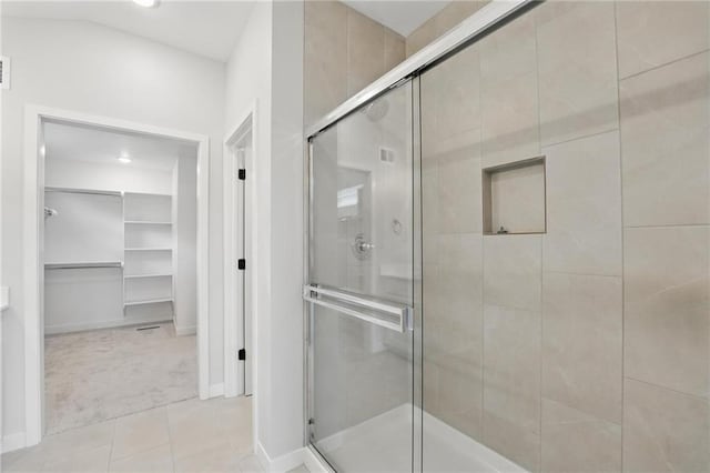 778 Creekmoor Dr, Raymore, MO 64083 - full bath featuring a stall shower, a walk in closet, tile patterned flooring, and recessed lighting