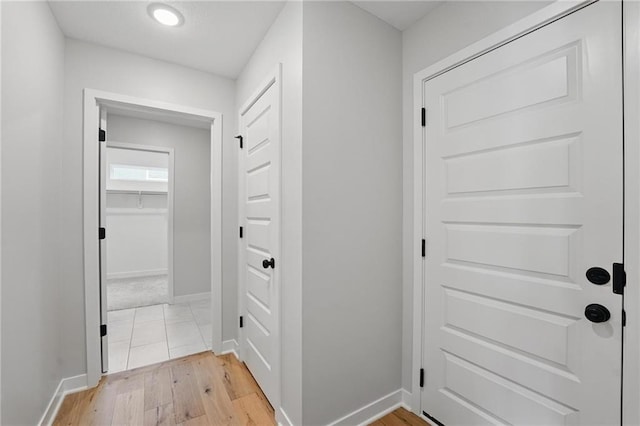 778 Creekmoor Dr, Raymore, MO 64083 - doorway with baseboards and light wood-style floors