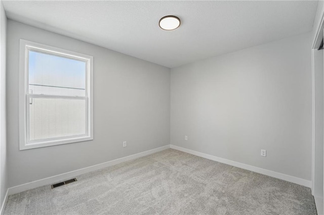 778 Creekmoor Dr, Raymore, MO 64083 - carpeted empty room with baseboards
