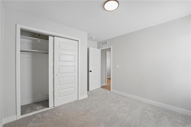 778 Creekmoor Dr, Raymore, MO 64083 - unfurnished bedroom featuring carpet flooring and a closet