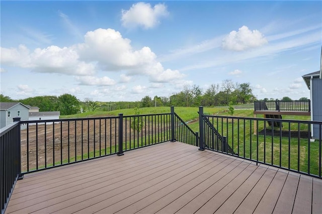 778 Creekmoor Dr, Raymore, MO 64083 - wooden terrace with a lawn