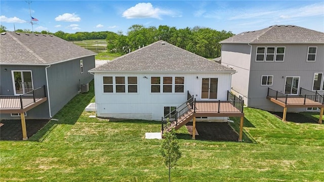778 Creekmoor Dr, Raymore, MO 64083 - back of property featuring a wooden deck, roof with shingles, a yard, and stairs