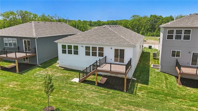 778 Creekmoor Dr, Raymore, MO 64083 - back of house with roof with shingles, a deck, a yard, and stairway