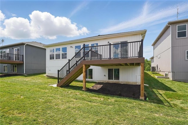 778 Creekmoor Dr, Raymore, MO 64083 - back of property featuring a yard, a wooden deck, and stairs