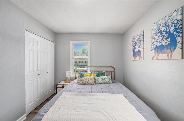 5117 Palmer Dr, Kansas City, MO 64129 - bedroom with wood finished floors and a closet