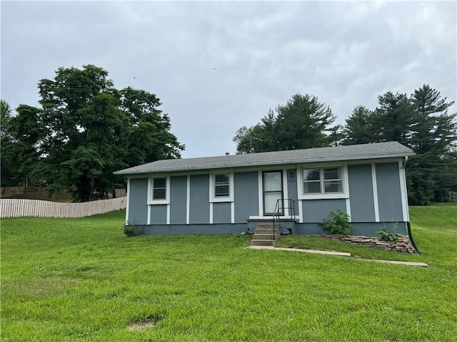 1423 Hickory St, Atchison, KS 66002 - view of front of home with stucco siding and a shingled roof