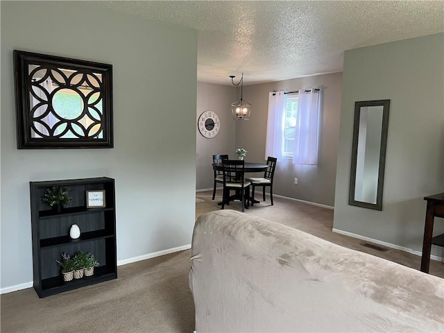 1423 Hickory St, Atchison, KS 66002 - dining space with a textured ceiling and carpet floors