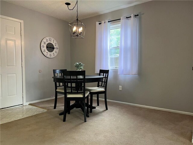 1423 Hickory St, Atchison, KS 66002 - dining area with a chandelier and light colored carpet