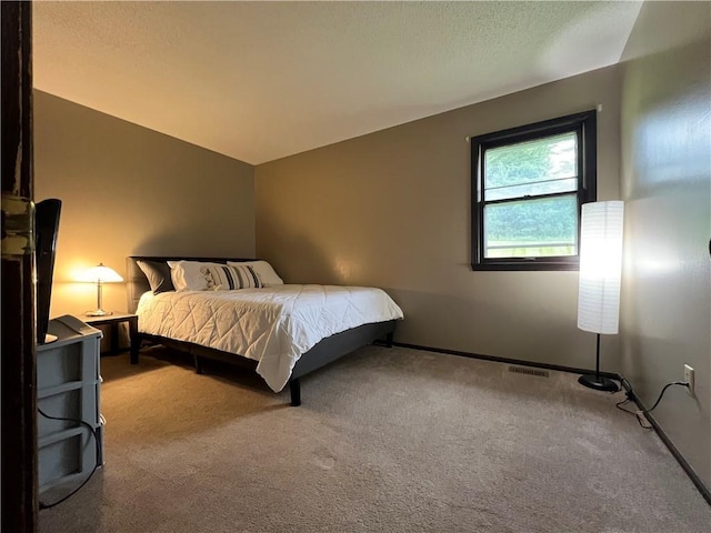 1423 Hickory St, Atchison, KS 66002 - carpeted bedroom featuring lofted ceiling and baseboards