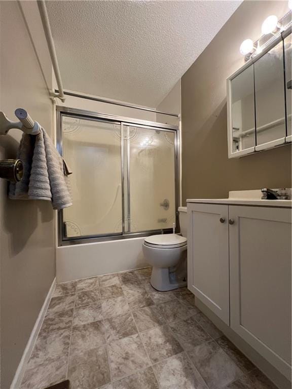 1423 Hickory St, Atchison, KS 66002 - full bathroom with vanity, a textured ceiling, and bath / shower combo with glass door
