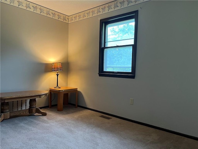 1423 Hickory St, Atchison, KS 66002 - carpeted empty room with baseboards