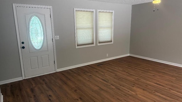 1146 NE 15th Rd, Knob Noster, MO 65336 - foyer entrance with dark wood-style flooring and a textured ceiling