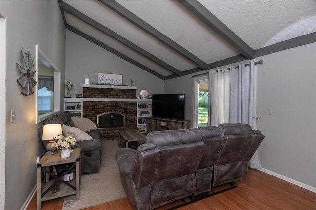 1005 SE Alice St, Blue Springs, MO 64014 - living area featuring wood finished floors and a brick fireplace