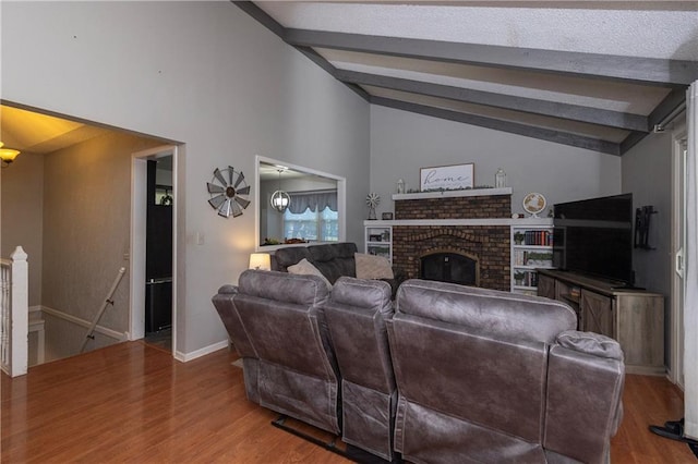 1005 SE Alice St, Blue Springs, MO 64014 - living room with wood finished floors and a brick fireplace