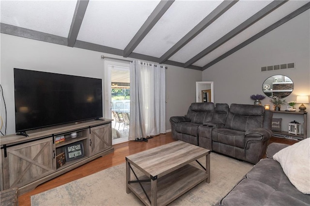 1005 SE Alice St, Blue Springs, MO 64014 - living room featuring beamed ceiling, wood finished floors, and high vaulted ceiling