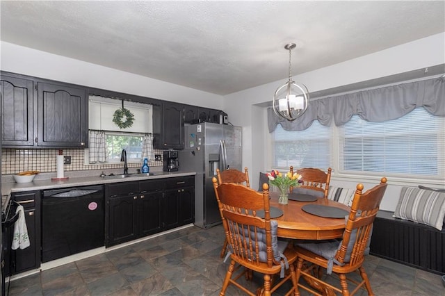 1005 SE Alice St, Blue Springs, MO 64014 - dining area with a chandelier and dark stone finish floors