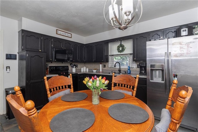 1005 SE Alice St, Blue Springs, MO 64014 - dining area with a chandelier