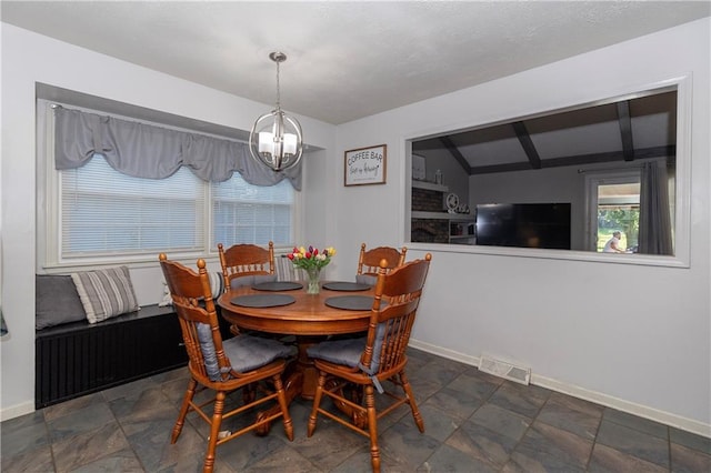 1005 SE Alice St, Blue Springs, MO 64014 - dining room with a chandelier and stone finish flooring