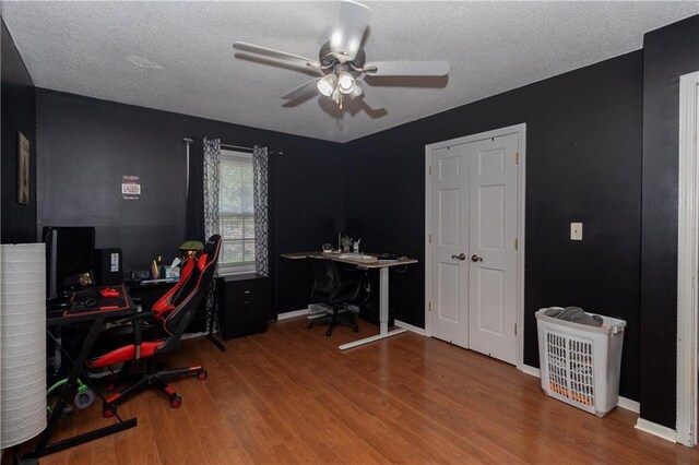 1005 SE Alice St, Blue Springs, MO 64014 - office featuring ceiling fan, wood finished floors, and a textured ceiling
