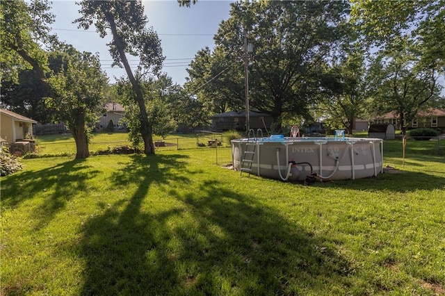1005 SE Alice St, Blue Springs, MO 64014 - view of yard with an outdoor pool