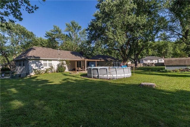 1005 SE Alice St, Blue Springs, MO 64014 - fenced backyard featuring a covered pool