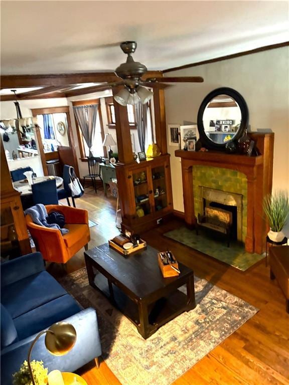 4020 Campbell St, Kansas City, MO 64110 - living room with ceiling fan, wood finished floors, and a fireplace with flush hearth
