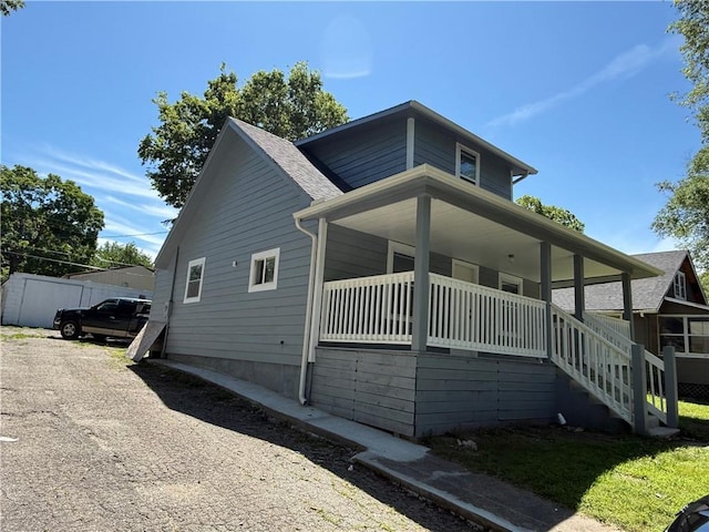 1515 S Home Ave, Independence, MO 64052 - view of home's exterior with covered porch and stairs