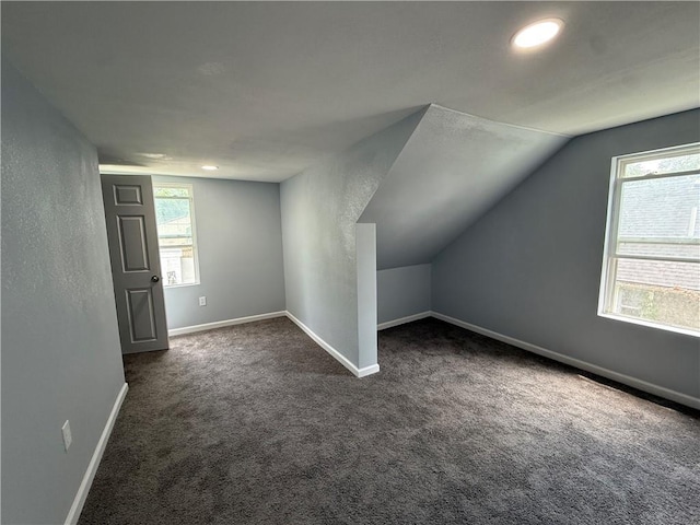 1515 S Home Ave, Independence, MO 64052 - additional living space with dark carpet, lofted ceiling, and recessed lighting