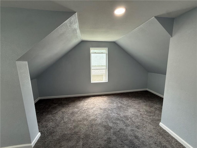 1515 S Home Ave, Independence, MO 64052 - additional living space featuring carpet and vaulted ceiling