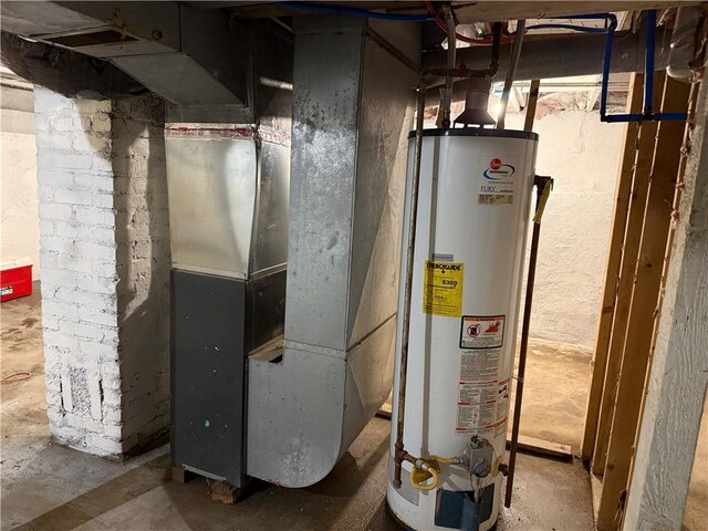 1515 S Home Ave, Independence, MO 64052 - utility room with water heater and heating unit