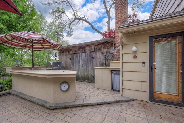 9015 Outlook Dr, Overland Park, KS 66207 - view of patio featuring exterior kitchen