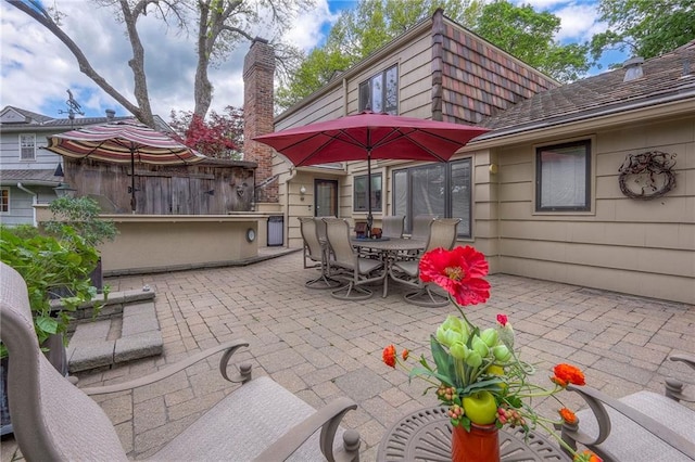 9015 Outlook Dr, Overland Park, KS 66207 - view of patio featuring outdoor dining area