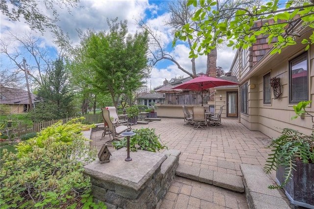 9015 Outlook Dr, Overland Park, KS 66207 - view of patio featuring outdoor dining space